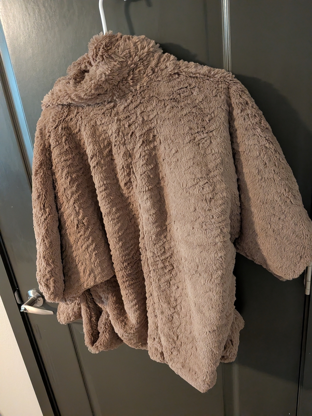 Jolt brand faux fur teddy jacket featuring a plush tan texture and front pockets